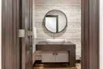 Elegant powder room featuring a contemporary vanity and modern design.